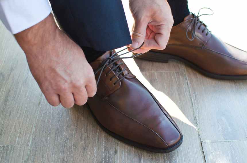 close up of man wearing shoes